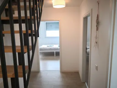 Ein Bett oder Betten in einem Zimmer der Unterkunft Beautiful Maisonette in Mörfelden-Walldorf
