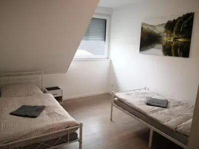 Ein Bett oder Betten in einem Zimmer der Unterkunft Beautiful Maisonette in Mörfelden-Walldorf