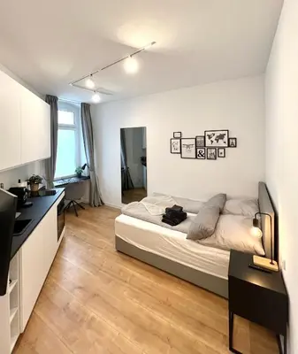 Ein Bett oder Betten in einem Zimmer der Unterkunft Modernes Apartment im Zentrum von Karlsruhe