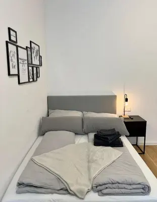 Ein Bett oder Betten in einem Zimmer der Unterkunft Modernes Apartment im Zentrum von Karlsruhe