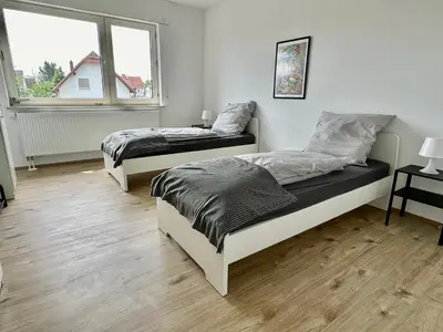 Ein Bett oder Betten in einem Zimmer der Unterkunft Rhein Quartier - Biebesheim