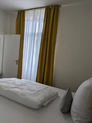 Ein Bett oder Betten in einem Zimmer der Unterkunft Gasthaus Mandelhof