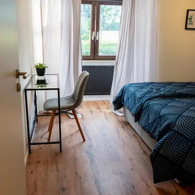 Ein Bett oder Betten in einem Zimmer der Unterkunft M Apartment Charme - gemütlich geräumig heimisch