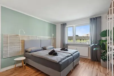 Ein Bett oder Betten in einem Zimmer der Unterkunft Amalfi Apartments A01 - gemütliche 2 Zi-Wohnung mit Boxspringbetten und smart TV
