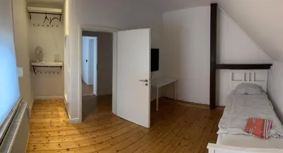 Ein Bett oder Betten in einem Zimmer der Unterkunft Haus Lutherbaum 4 Zimmer