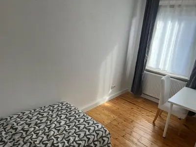 Ein Bett oder Betten in einem Zimmer der Unterkunft Haus Lutherbaum 4 Zimmer
