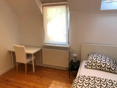 Ein Bett oder Betten in einem Zimmer der Unterkunft Haus Lutherbaum 4 Zimmer