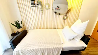 Ein Bett oder Betten in einem Zimmer der Unterkunft Ferienwohnungen Krüger ''Apartment Finn