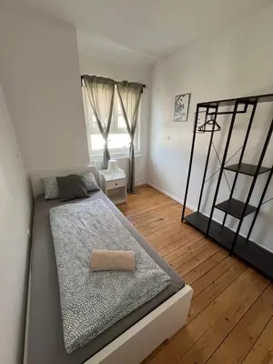 Ein Bett oder Betten in einem Zimmer der Unterkunft Altbauvilla im Herzen von Lorsch