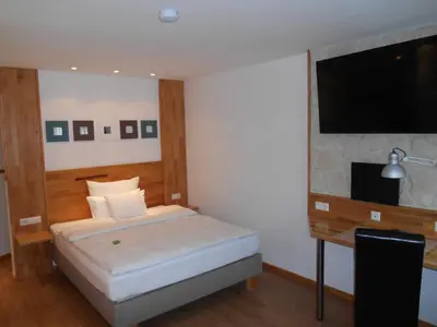 Ein Bett oder Betten in einem Zimmer der Unterkunft Warum ins Hotel