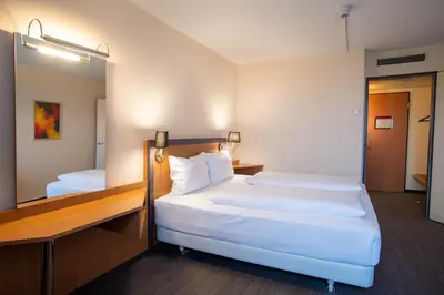 Ein Bett oder Betten in einem Zimmer der Unterkunft Best Western Conference Airporthotel Frankfurt Mörfelden