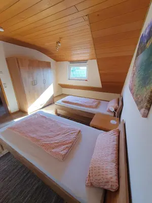 Ein Bett oder Betten in einem Zimmer der Unterkunft Ferienwohnung