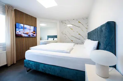 Ein Bett oder Betten in einem Zimmer der Unterkunft T&U Apartments