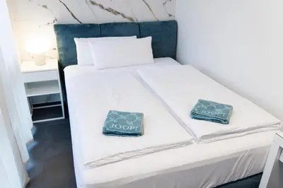 Ein Bett oder Betten in einem Zimmer der Unterkunft T&U Apartments