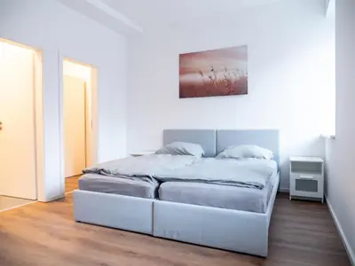 Ein Bett oder Betten in einem Zimmer der Unterkunft Appartmenthaus Karlsbad