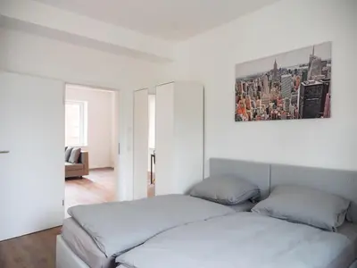 Ein Bett oder Betten in einem Zimmer der Unterkunft Appartmenthaus Karlsbad