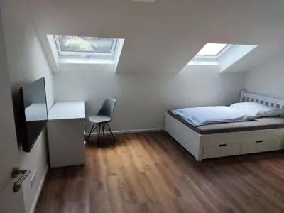 Ein Bett oder Betten in einem Zimmer der Unterkunft Apartmenthaus Pforzheim