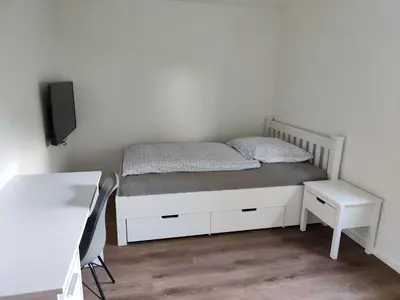 Ein Bett oder Betten in einem Zimmer der Unterkunft Apartmenthaus Pforzheim