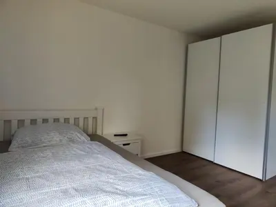 Ein Bett oder Betten in einem Zimmer der Unterkunft Apartmenthaus Pforzheim