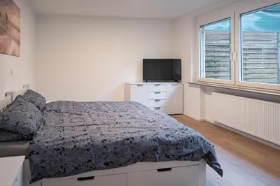 Ein Bett oder Betten in einem Zimmer der Unterkunft Monteurswohnungen in den Breitwiesen