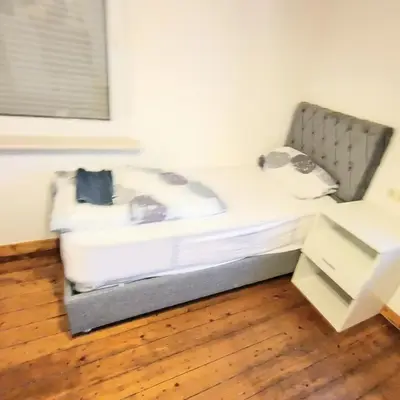 Ein Bett oder Betten in einem Zimmer der Unterkunft Bischofsheim15