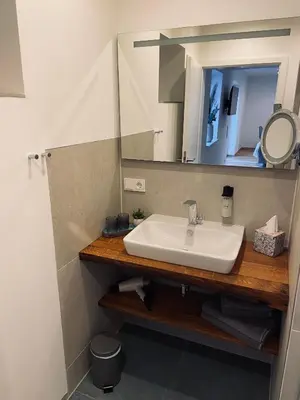 Ein Badezimmer in der Unterkunft HALBSTÜCK - Ferienwohnungen am Kropsbachpark