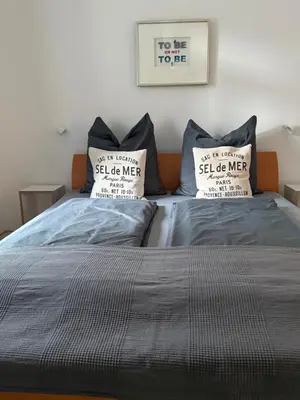 Ein Bett oder Betten in einem Zimmer der Unterkunft Schmuckstück an der Wormser Stadtmauer