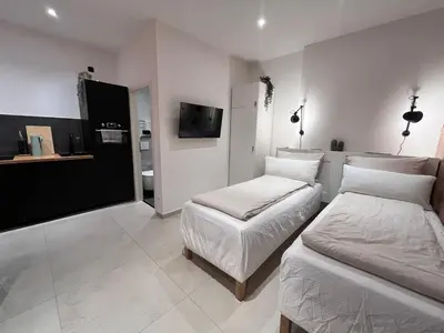 Ein Bett oder Betten in einem Zimmer der Unterkunft Goldstadt Apartments Pforzheim