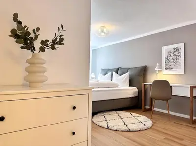 Ein Bett oder Betten in einem Zimmer der Unterkunft Appartio: Geräumige, moderne Ferienwohnung für Gruppen/Familien