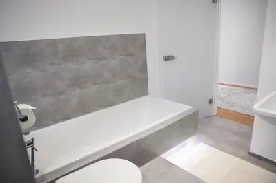 Ein Badezimmer in der Unterkunft NIRO I Design City Apartment, modern, ebenerdig, 3 Schlafzimmer