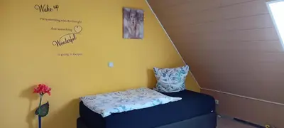 Ein Bett oder Betten in einem Zimmer der Unterkunft FeWo Sommertraum, Netflix