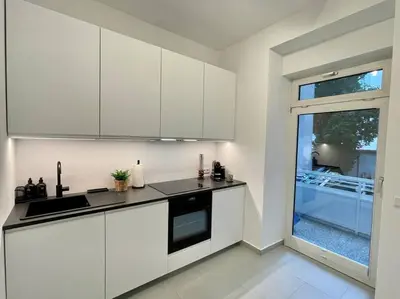 Küche/Küchenzeile in der Unterkunft Stylisches Apartment in zentraler Lage mit Balkon