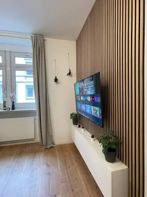 TV/Unterhaltungsangebot in der Unterkunft Stylisches Apartment in zentraler Lage mit Balkon