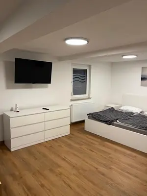 Ein Bett oder Betten in einem Zimmer der Unterkunft Home-for-you-Ferienwohnung Monteurwohnung