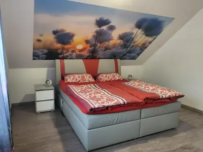 Ein Bett oder Betten in einem Zimmer der Unterkunft Ferienwohnung Sabine