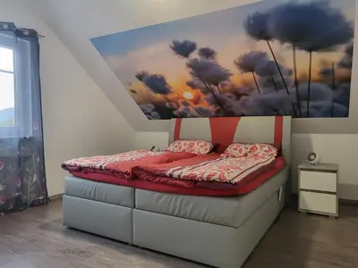 Ein Bett oder Betten in einem Zimmer der Unterkunft Ferienwohnung Sabine