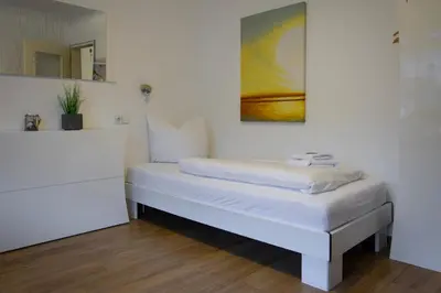 Ein Bett oder Betten in einem Zimmer der Unterkunft Hotel Sonnenhof Garni