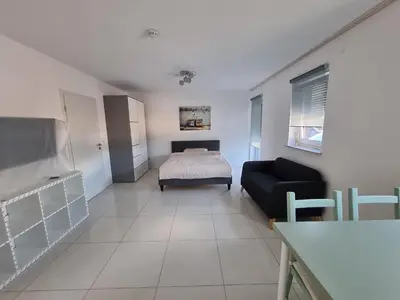 Ein Bett oder Betten in einem Zimmer der Unterkunft Landau, schöne helle gemütliche Wohnung
