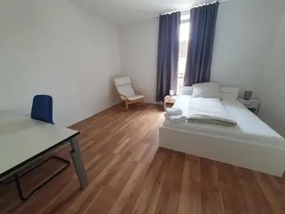 Ein Bett oder Betten in einem Zimmer der Unterkunft Gemütliches Privatzimmer an der Uniklinik Mainz. Sehr zentral