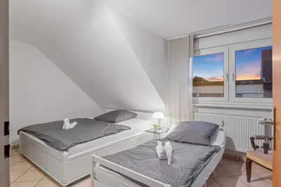 Ein Bett oder Betten in einem Zimmer der Unterkunft Family and Friends Ludwigshafen