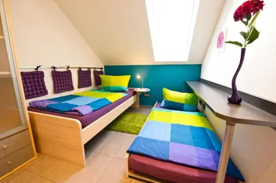 Ein Bett oder Betten in einem Zimmer der Unterkunft Design-Wohnungen by Ulrike Horster