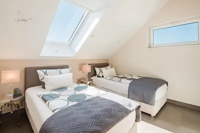 Ein Bett oder Betten in einem Zimmer der Unterkunft Design-Wohnungen by Ulrike Horster