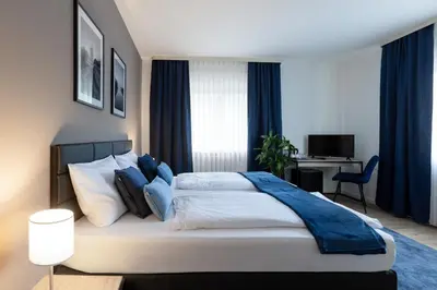 Ein Bett oder Betten in einem Zimmer der Unterkunft Hotel Wegener