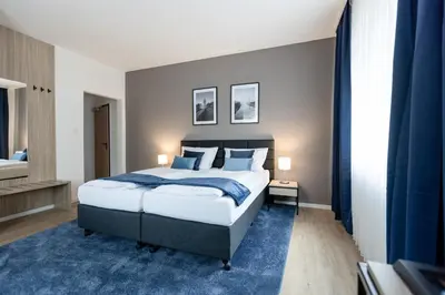 Ein Bett oder Betten in einem Zimmer der Unterkunft Hotel Wegener