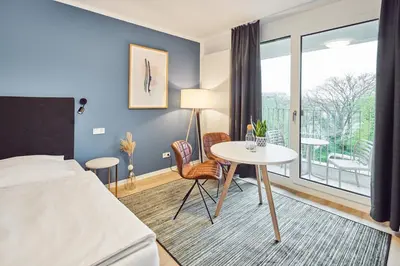 Ein Bett oder Betten in einem Zimmer der Unterkunft Rosenberg Quartier
