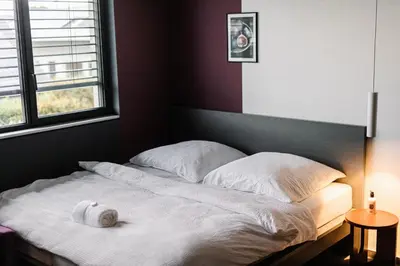 Ein Bett oder Betten in einem Zimmer der Unterkunft Exklusive Design Appartement BlackBerry Neubau