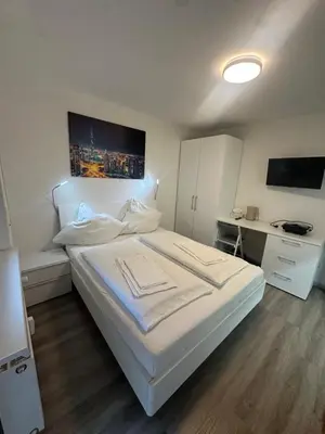 Ein Bett oder Betten in einem Zimmer der Unterkunft Tolle FeWo direkt am Campus 24-7 Checkin