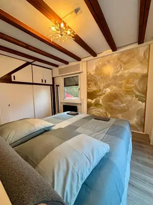Ein Bett oder Betten in einem Zimmer der Unterkunft Ferienhaus Veronika Odenwald