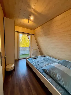 Ein Bett oder Betten in einem Zimmer der Unterkunft Ferienhaus Veronika Odenwald