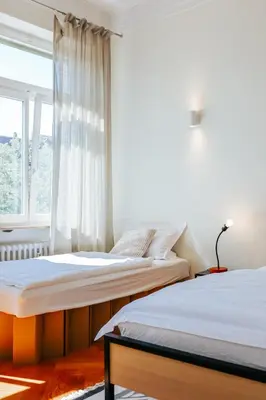 Ein Bett oder Betten in einem Zimmer der Unterkunft namastay! Exklusiver Altbau in Bestlage - 3BR